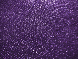 beautiful texture emboss blurred background of close up foam sheet in dark pruple color, plastic foam sheet background dark violet color, focus and blurred texture background dark purple colors