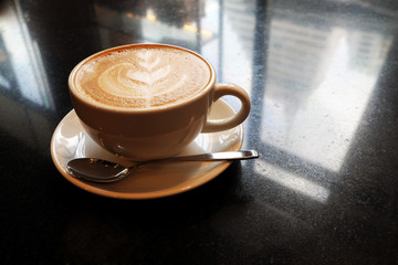Latte coffee on stone table