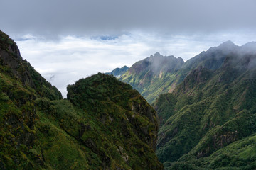 Naklejka premium Mountain with clouds in Sapa town, southern Vietnam