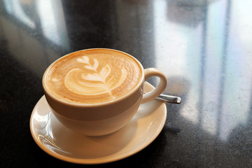 Latte coffee on stone table