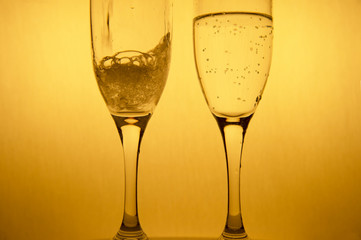 movement of poring alcohol drinking in couple golden champagne glasses for luxury Christmas celebration party background