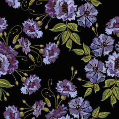 Embroidery violet flowers bells seamless pattern. Fashionable template for design of clothes. Beautiful cornflowers seamless background