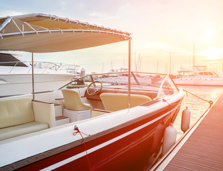 View of harbor with yachts details. Beautiful sunset sky in the marina bay.