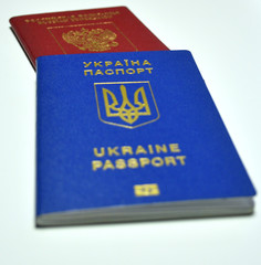 Russian and Ukrainian foreign (international) passports on white background. Isolated. Selective focus