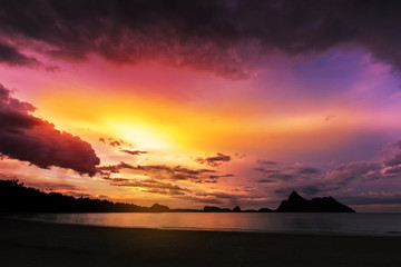 Naklejka na ściany i meble Sunset on the sea beach with mountains and colorful fantastic sky clouds. Ao Manao (Manao Bay) Prachuap Khiri Khan, thailand.