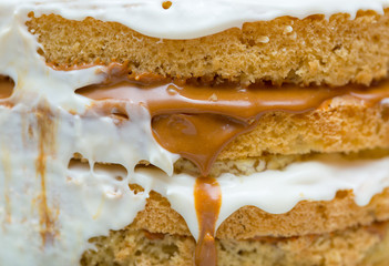 application of milk cream on the surface of the sweet cake