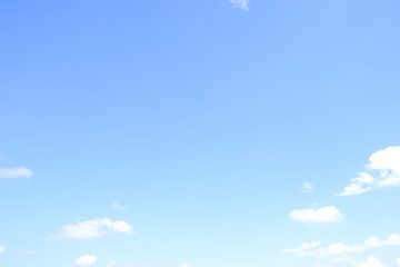 Soft white clouds and blue sky background.