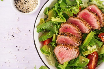 Tuna salad. Japanese traditional salad with pieces of medium-rare grilled Ahi tuna and sesame with...