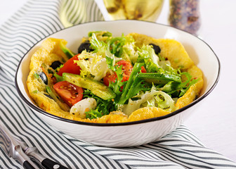 Omelet with fresh tomatoes, black olive, avocado and mozzarella cheese. Omelette salad. Breakfast. Healthy food.