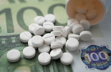 euro banknotes and tablets, medcal concept