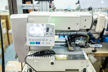 Fototapeta na wymiar Automatic multi-function compound sewing machine