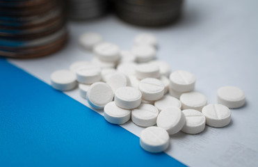 Obraz na płótnie Canvas Pharmaceutical business abstract, white pills on a blue background