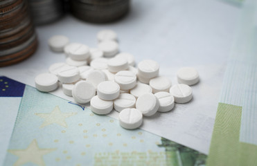 Pharmaceutical business abstract, white pills on a blue background