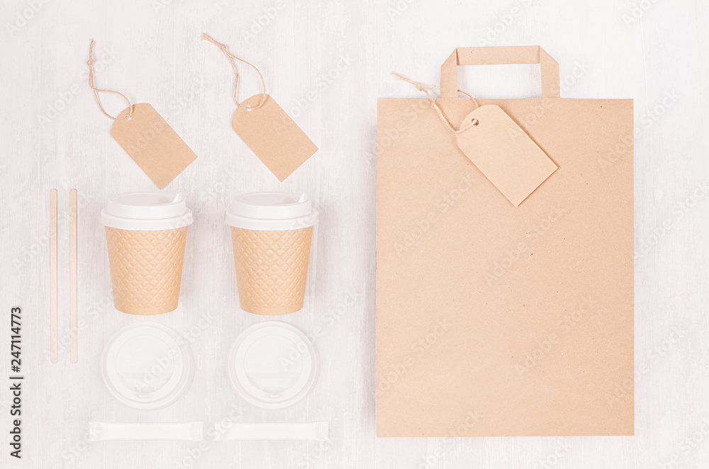 Wall mural coffee branding identity mockup - set of two brown paper cups with blank bag, label, cap, sugar on w