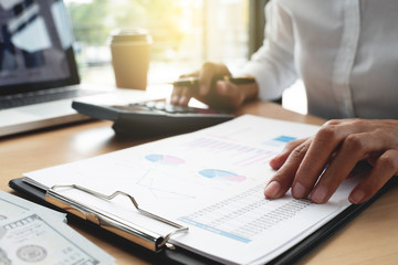 business auditor working with financial documents in office