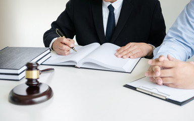 lawyer consultant give an advice with client at law firm.