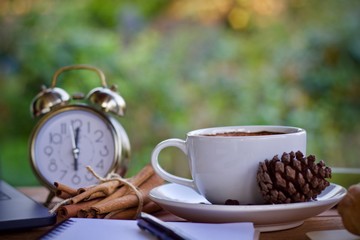 Desk work laptop notebook pen and coffee cup hot on wooden table