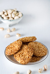 Traditional arabic dessert, cookies with nuts. White background.