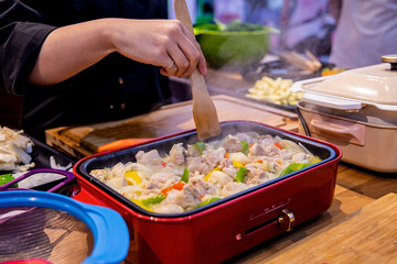 Housewife cooks in the kitchen cooking / restaurant chef cooking