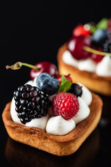 Fresh homemade fruit tart with cherry, blueberres and raspberries