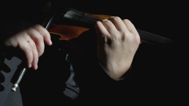 Violinist play on a violin