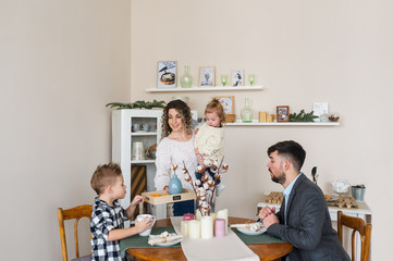 Obraz premium Happy family having breakfast at home.