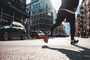 Sportsman rinning through urban streets. Prepearing marathon , healthy run concept