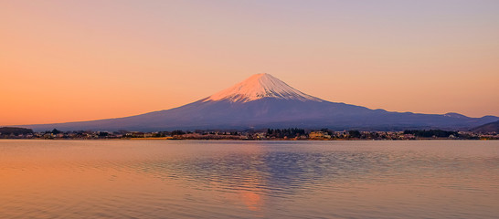 Reflection of Fuji mountain with snow capped in the morning Sunrise at Lake kawaguchiko, Yamanashi, Japan. landmark and popular for tourist attractions