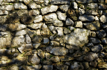 Alte Steinmauer im Sonnenlicht als Hintergrund oder Bildd