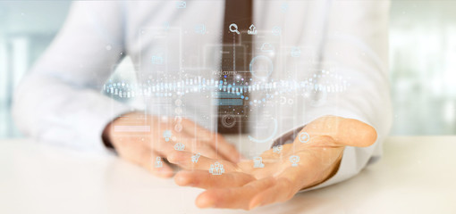Businessman holding User interface screens with icon, stats and data 3d rendering