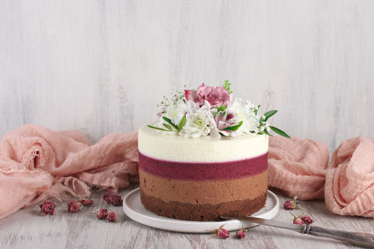 Fresh flowers decorated layered cake