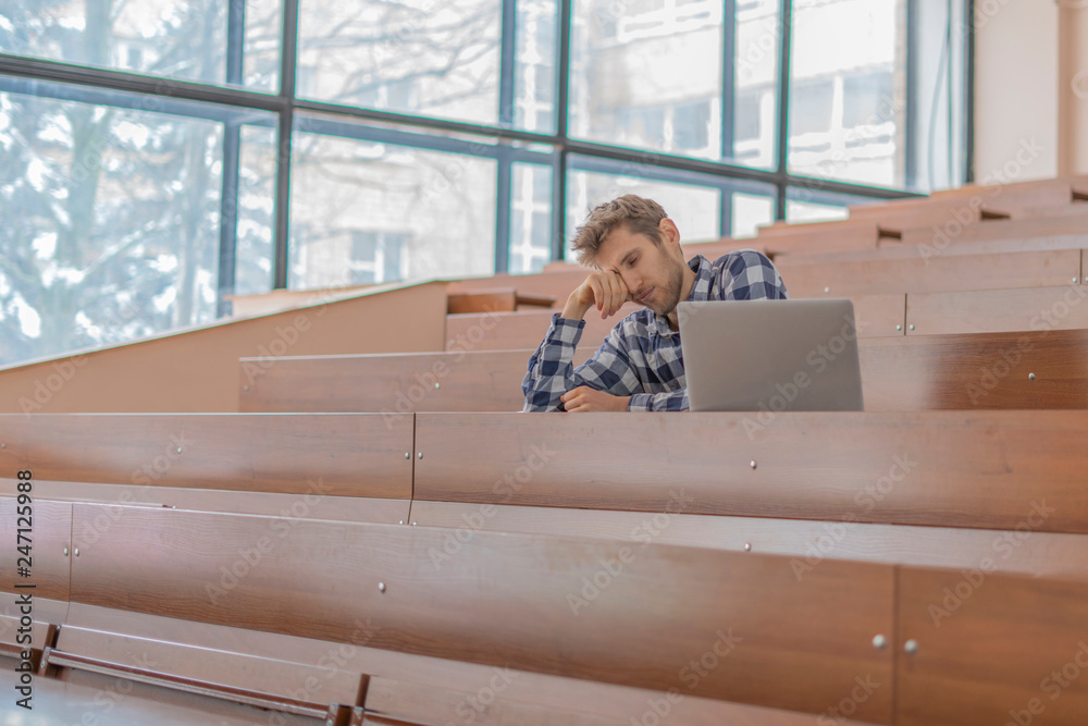 Wall mural tired from study student sleep in lecture hall b