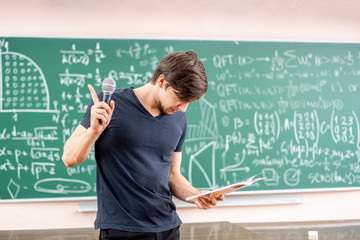 young man giving business meeting in conference hall b