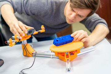 young male work with technologic 3d scanner in university b