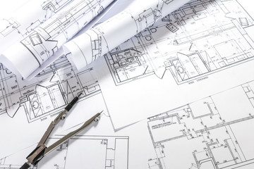 architect design working drawing sketch plans blueprints and making architectural construction model in architect studio