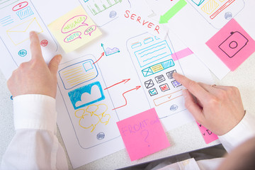 Ui designer working in office at desk.