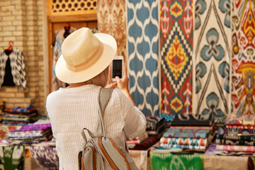 The girl walking around the old town taking pictures for the blog 