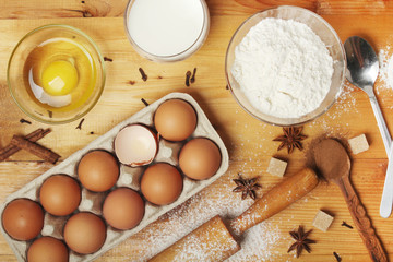 Fototapeta na wymiar Food ingredients for baking: flour, eggs, milk, sugar 