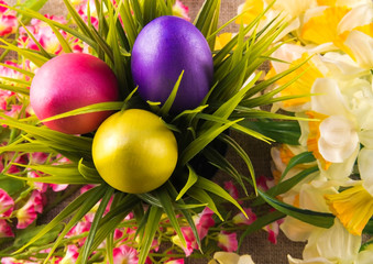 Easter background with easter eggs. Painted Easter eggs. Easter flowers. Easter holiday