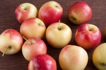 apples scattered on a wooden table