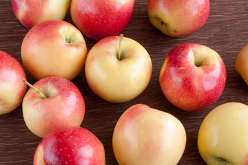 apples scattered on a wooden table