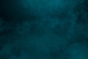 Fototapeta na wymiar Colorful smoke close-up on a black background
