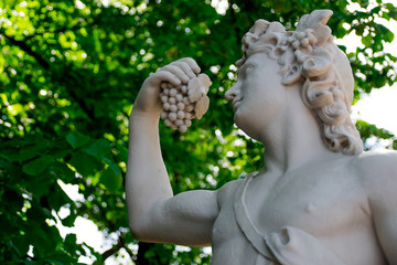 Statue of Bacchus in the Summer Garden in Saint Peterburg, Russia - obrazy, fototapety, plakaty