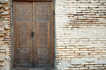 Old Vintage Wooden Door in Grunge Brick Wall