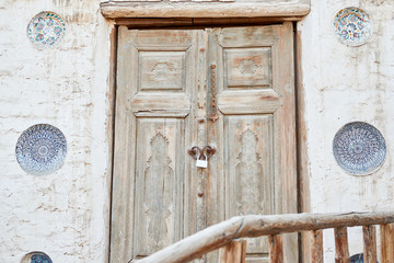 Old Vintage Wooden Door in Grunge Brick Wall
