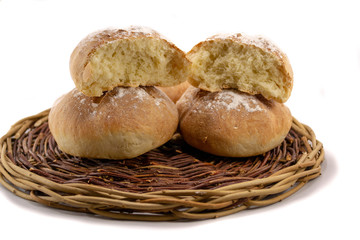 Fototapeta premium Fresh baked homemade bread in a wicker wood basket