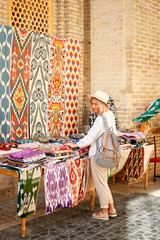 Woman Buy Colorful East Fabric Souvenir