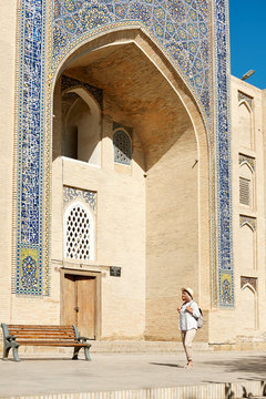 Woman Travaler in Central Asia Mosque Vault Entrance