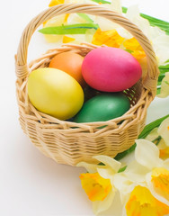Easter background with easter eggs. Painted Easter eggs. Easter flowers. Easter holiday