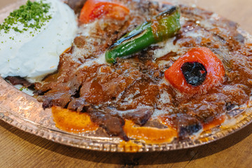 Turkish Doner Kebab, Shawarma or Gyros. Traditional Turkish Doner Kebab meat, iskender, shawarma or gyros in restaurant